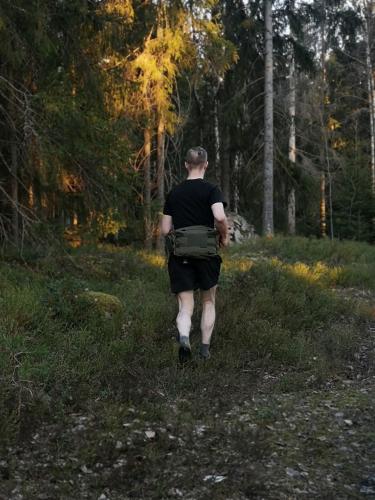 Savotta Askare Hip Pack. Comfortable while trail running. Pictured in this photo is a prototype with accessories - tourniquet pouch and buckles for combat pack attachment.